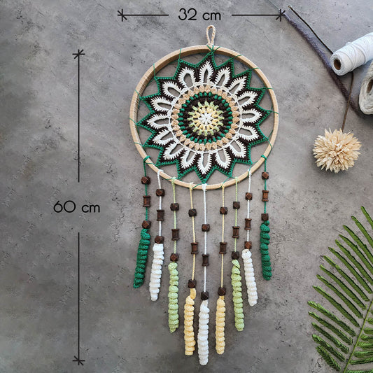 “Enchanting Greens Dreamcatcher” by ArtixHub – macramé dreamcatcher in moss, sage, and mint hues with wooden beads and curly tassels, evoking woodland tranquility. Ideal for bedrooms, reading corners, or boho-chic spaces, weaving nature’s calm into UAE interiors.