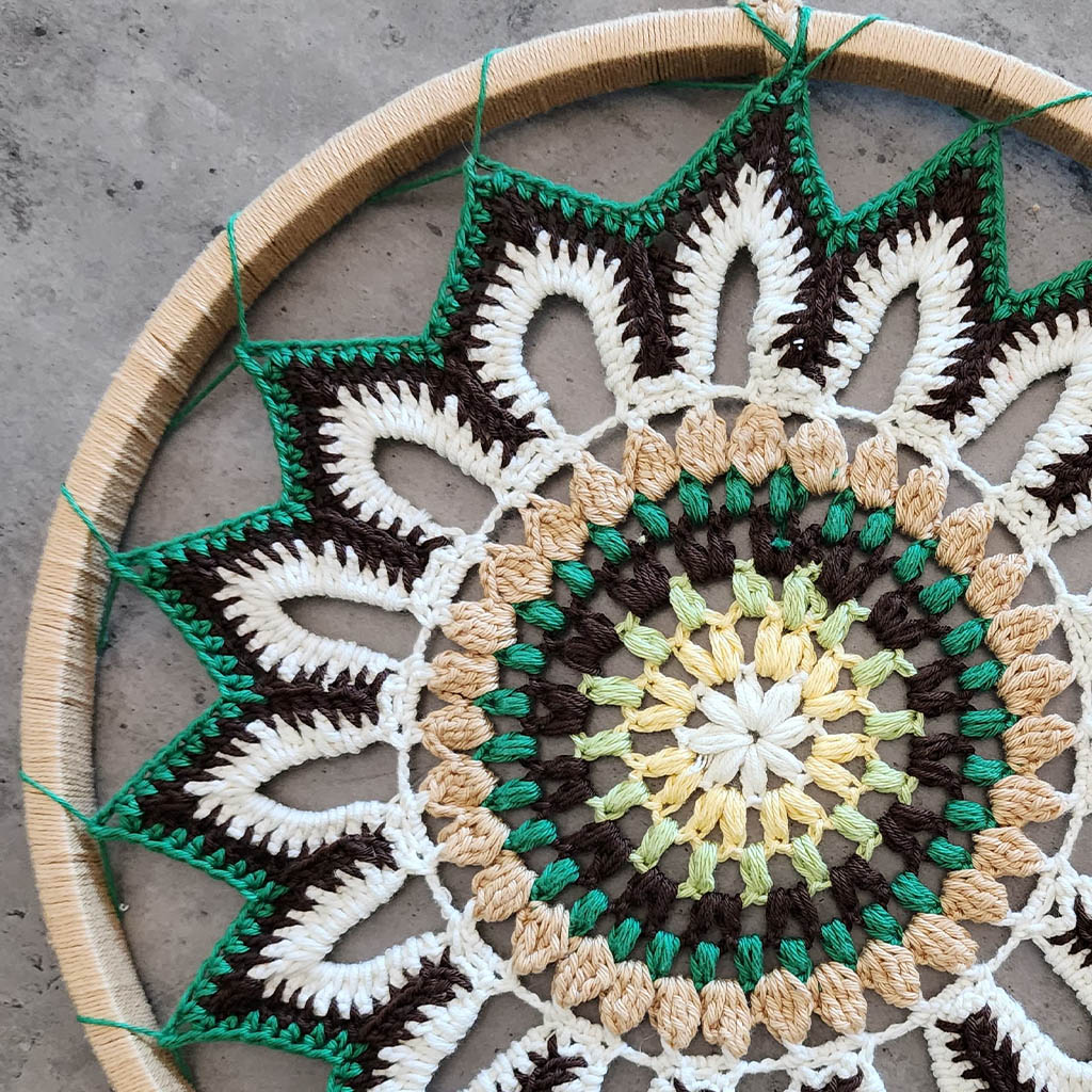 “Enchanting Greens Dreamcatcher” by ArtixHub – macramé dreamcatcher in moss, sage, and mint hues with wooden beads and curly tassels, evoking woodland tranquility. Ideal for bedrooms, reading corners, or boho-chic spaces, weaving nature’s calm into UAE interiors.