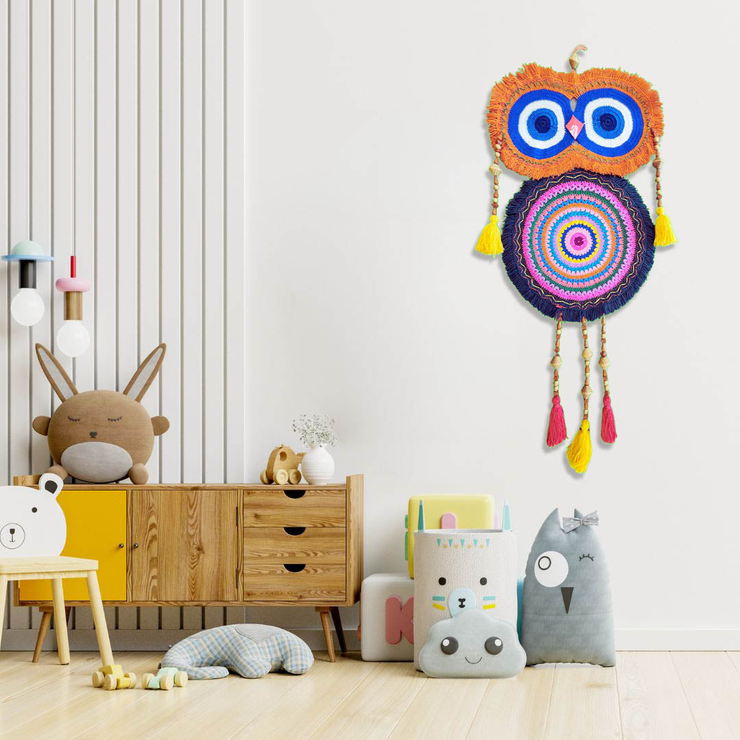 “Rainbow Owl Dreamer” by ArtixHub – colorful macramé owl wall hanging with orange, blue, and pink loops, wood beads, and tasseled feathers, capturing playful whimsy. Ideal for kids’ rooms, creative studios, or eclectic living spaces, infusing UAE interiors with joyful charm.