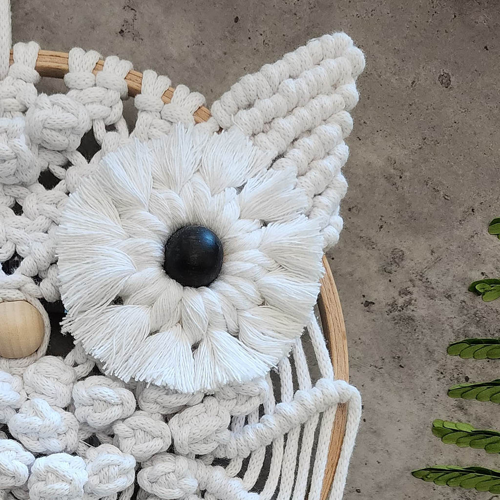 “Wise Guardian” by ArtixHub – natural-tone macramé owl perched on a wooden dowel, featuring textured bobbles and fringe that evoke nocturnal wisdom. Ideal for home offices, libraries, or bohemian living rooms, adding a touch of woodland magic to UAE décor.
