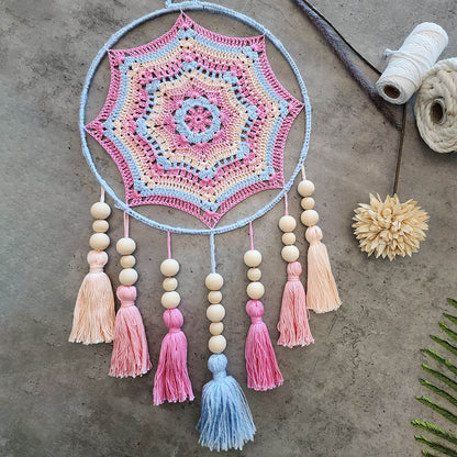 "Dreamscape" by ArtixHub – macramé wall hanging with pastel pink and blue tassels accented by natural wood beads, creating a playful cascade of color and texture. Ideal for nurseries, playrooms, or boho-inspired living spaces, adding whimsical charm to UAE interiors.