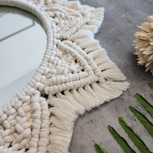 “Halo Mirror” by ArtixHub – handcrafted macramé sunburst mirror with cotton fringe radiating around a central glass, reflecting light and texture. Ideal for entryways, bathrooms, or living rooms, adding boho-chic illumination to UAE homes.