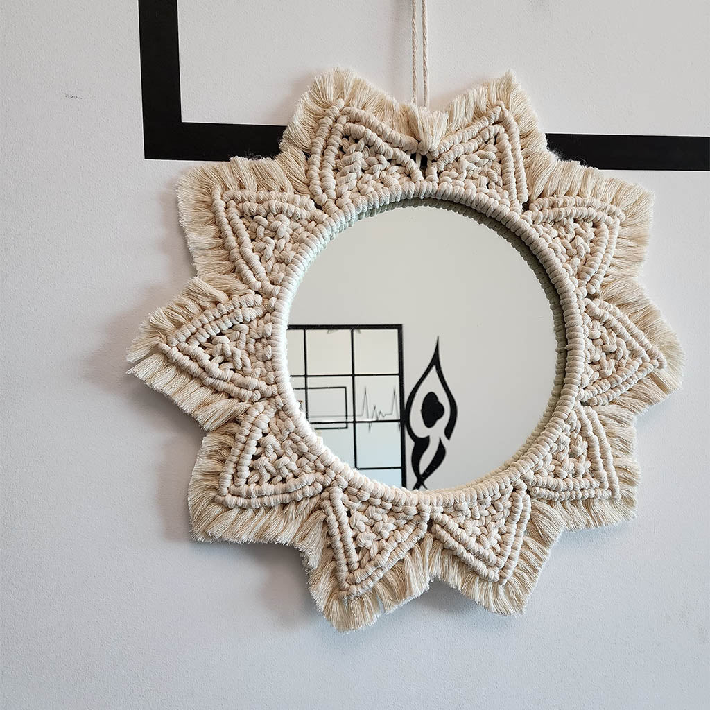 “Halo Mirror” by ArtixHub – handcrafted macramé sunburst mirror with cotton fringe radiating around a central glass, reflecting light and texture. Ideal for entryways, bathrooms, or living rooms, adding boho-chic illumination to UAE homes.
