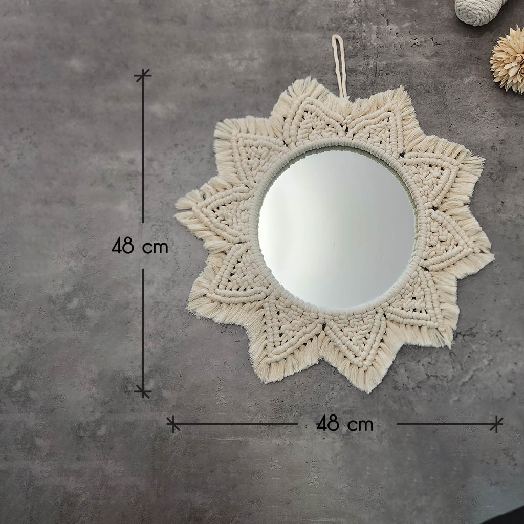 “Halo Mirror” by ArtixHub – handcrafted macramé sunburst mirror with cotton fringe radiating around a central glass, reflecting light and texture. Ideal for entryways, bathrooms, or living rooms, adding boho-chic illumination to UAE homes.