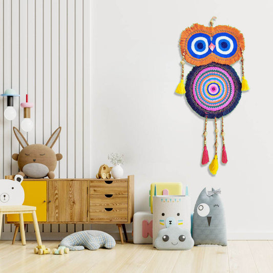 “Rainbow Owl Dreamer” by ArtixHub – colorful macramé owl wall hanging with orange, blue, and pink loops, wood beads, and tasseled feathers, capturing playful whimsy. Ideal for kids’ rooms, creative studios, or eclectic living spaces, infusing UAE interiors with joyful charm.