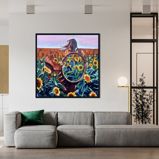 Colorful painting of a person with a large round mirror surrounded by sunflowers. Inside Out painting by Mira Ayyash showing a woman in a sunflower field holding a circular mirror that reflects more sunflowers in a surreal style