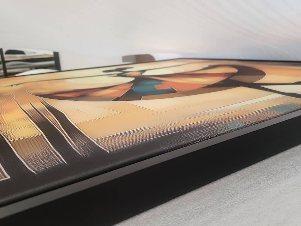 Close-up of a framed canvas print showing fine surface texture and colour depth.